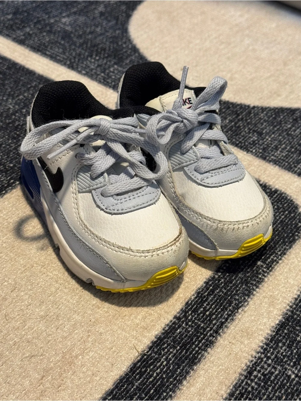 Nike Toddler White, Blue & Black Lightweight Sneakers with Yellow Accent